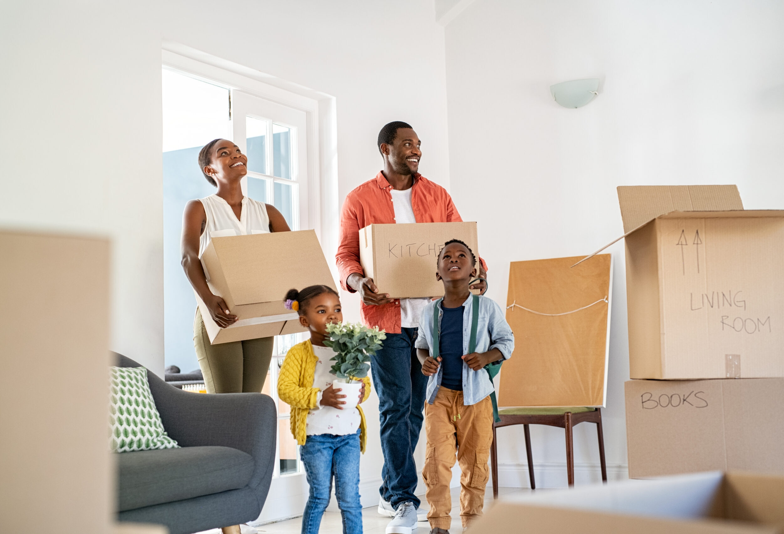 Black family with two children moving house