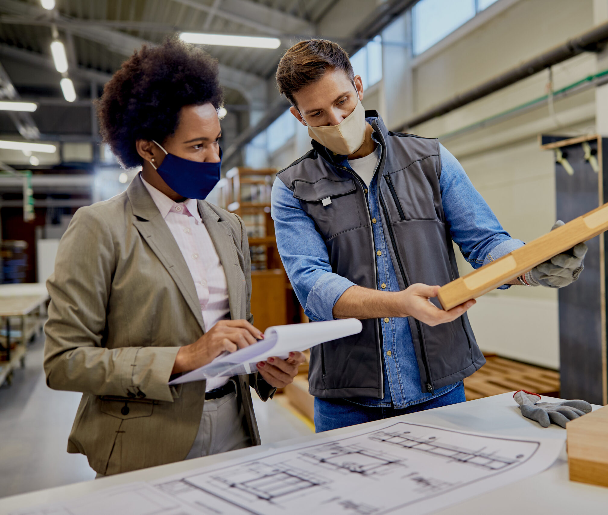African,American,Businesswoman,And,Woodworker,Analyzing,Piece,Of,Processed,Wood
